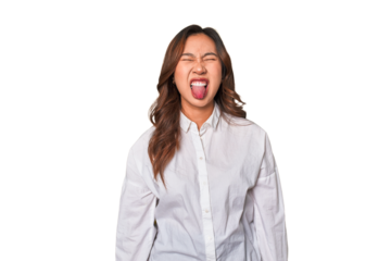 A young chinese woman funny and friendly sticking out tongue.