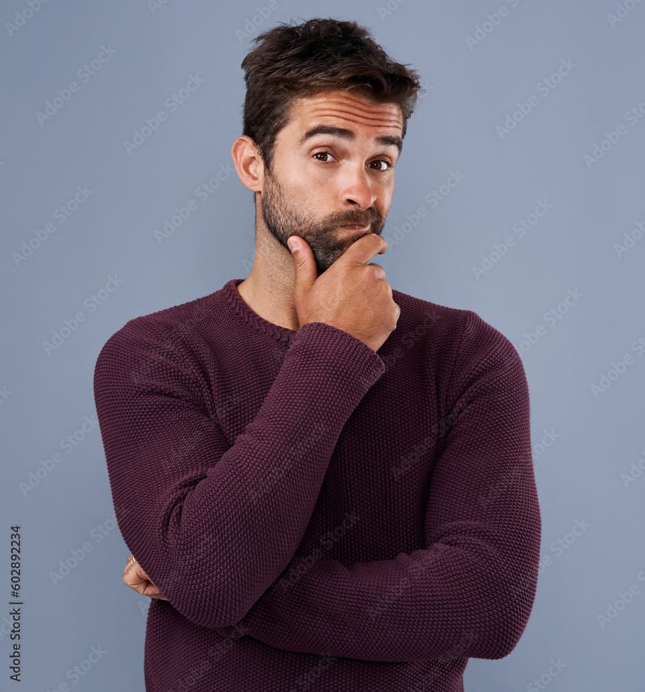 Poster idea, thinking and portrait of man in studio with unsure, wonder and thoughtful on blue background. 