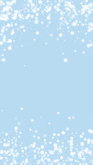 Beautiful snowfall christmas background. Subtle flying snow flakes and stars on light blue winter backdrop. Beautiful snowfall overlay template. Vertical vector illustration.