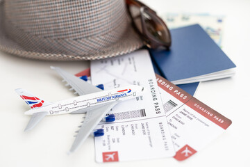 Tourist concept. Passport with airplane, tickets, hat, glasses