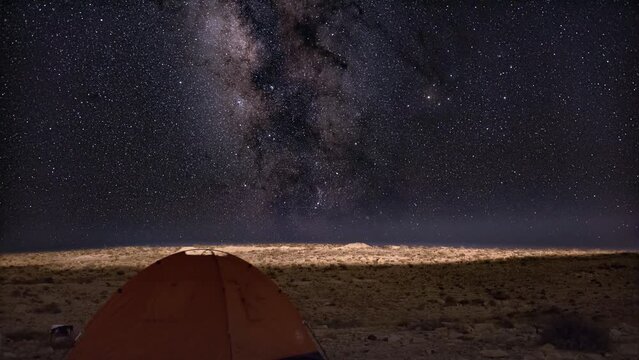 Milky way stars time lapse with tent camping alone in the dark, desert, Israel