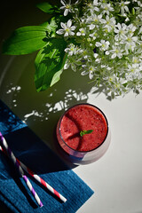Fresh Berry Smoothie, Paper Straws and Star of Bethlehem Flowers in vase