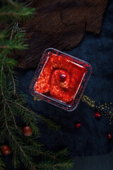 christmas decoration on red cake on a plate - 602898015