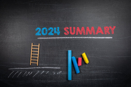 2024 Summary. Text and colored pieces of chalk on a dark chalkboard