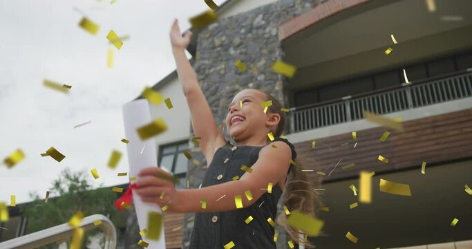 Animation of gold confetti over celebrating caucasian schoolgirl throwing mortar board in air
