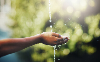 Hands, water splash and cleaning in nature outdoor for hygiene, health and wellness for hydration...