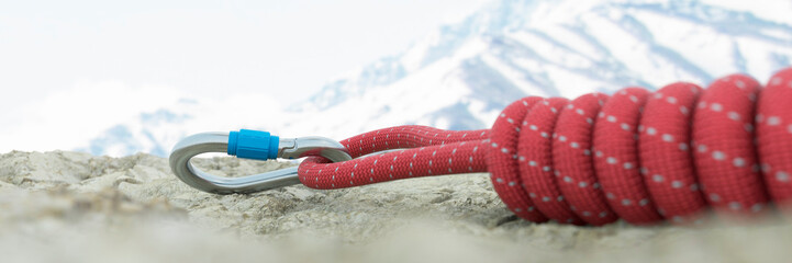 Mountaineering carabiner attached to a rope on a rock climbing trail 3d render © Studio-FI