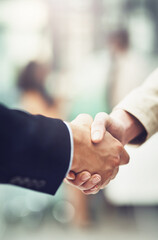 Partnership, deal and business people shaking hands in office after a meeting or interview....