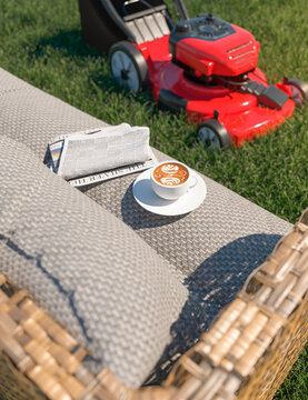 Taking a break on a sunny summers day enjoying a coffee and sit down in the garden after cutting the grass 3d render