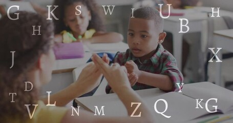 Animation of letters over diverse female teacher and schoolboy signing in class - Powered by Adobe