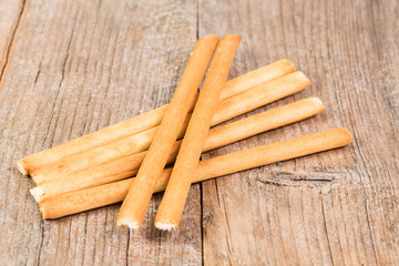 bread sticks grissini on wooden background