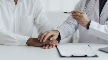 Close up view of professional physician consulting with male patient, talking to male client at medical checkup visit