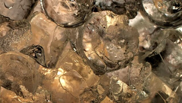 Immersive 4k Slo-motion footage of the summer drink delight. Chilled, fizzy elixir on ice. Tantalising swirls to quench your thirst with this refreshing cola, juice or cider.