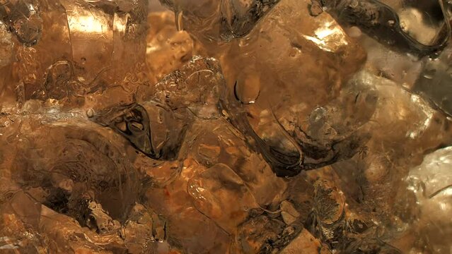 Immersive 4k Slo-motion footage of the summer drink delight. Chilled, fizzy elixir on ice. Tantalising swirls to quench your thirst with this refreshing cola, juice or cider.