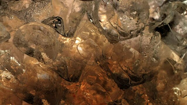 Immersive 4k Slo-motion footage of the summer drink delight. Chilled, fizzy elixir on ice. Tantalising swirls to quench your thirst with this refreshing cola, juice or cider.