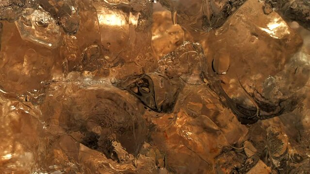 Immersive 4k Slo-motion footage of the summer drink delight. Chilled, fizzy elixir on ice. Tantalising swirls to quench your thirst with this refreshing cola, juice or cider.