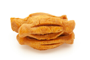 Three pieces of salted Masala crispy and crunchy Karela Mathri or Matthi. Isolated on white background.