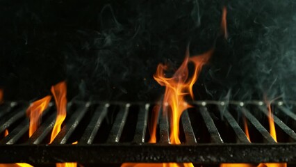 Super slow motion of flames with empty grill grid. Filmed on high speed cinema camera, 1000 fps. Isolated on black background.
