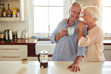 Hug, coffee or happy old couple in kitchen at home bonding or enjoying quality morning time...