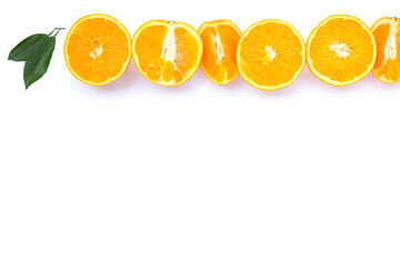 Orange fruit with green leaves on white background.