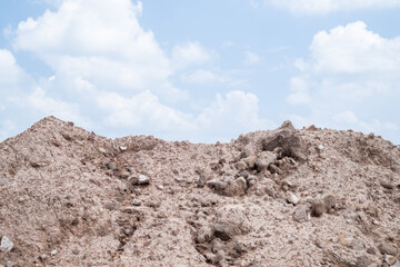 Pile Soil or dirt on blue sky.