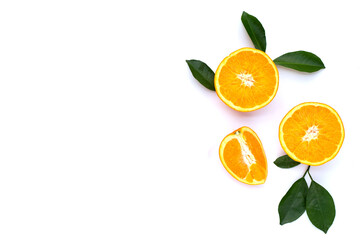 Orange fruit with green leaves on white background.