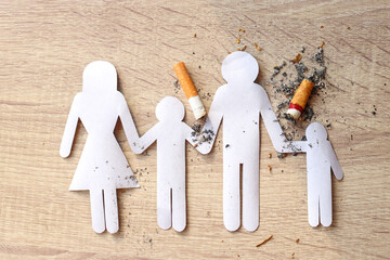 Paper cut of family destroyed by cigarettes. Quit smoking for life on World no Tobacco day concept.