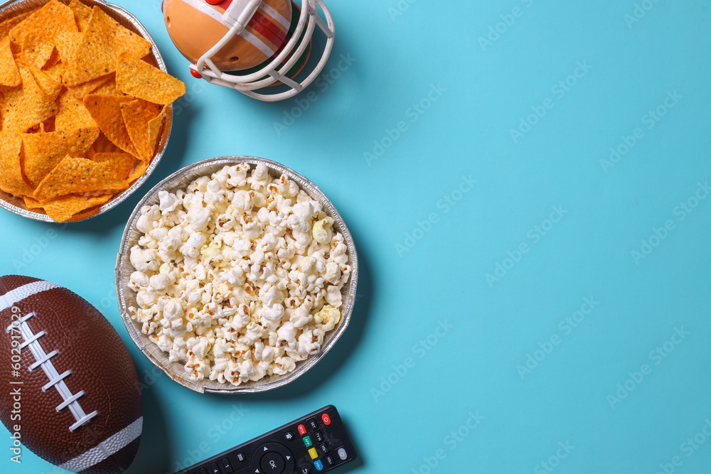 Wall mural Top view of snacks for watching a football game with copy space