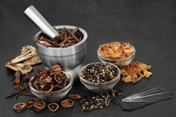 Chinese acupuncture treatment with needles, herbs, spice. Natural plant medicine remedy for alternative health care concept.