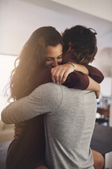 Woman, man and hug in home for love, care and quality time together with commitment to...
