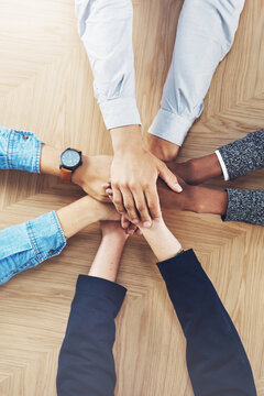 Goals, planning or hands of business people in support for faith, community or strategy in startup office. Teamwork, vision or above of employees in group collaboration with hope or mission together