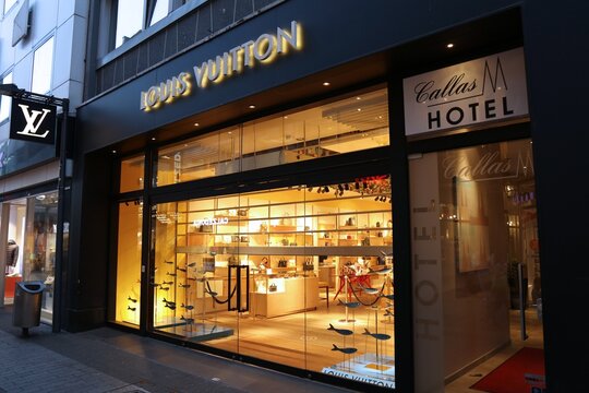 COLOGNE, GERMANY - SEPTEMBER 21, 2020: Louis Vuitton premium fashion store in Hohe Strasse (High Street) of Cologne, Germany. Hohe Strasse is one of busiest shopping destinations in Germany.