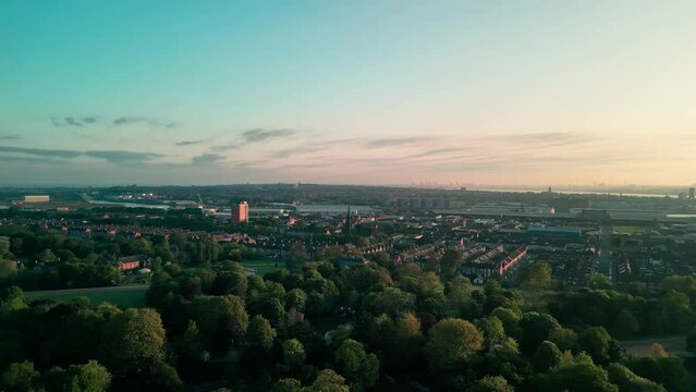 Birkenhead Park, upon which Central Park NY is based - Aerial drone at dawn, rise and fast pan right, Liverpool skyline reveal - May 23