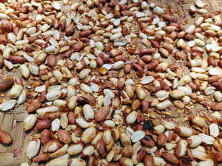 Roasted peanuts in the shell. Fried Nuts for a healthy diet and nutrition. Fresh ripe peanuts. Top view.