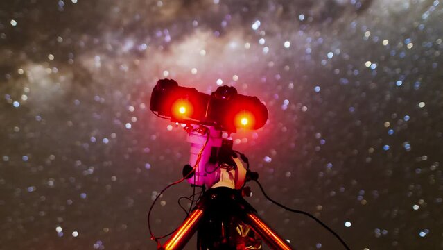 Captivating footage of the Milky Way galaxy shot in Namibia's starry night sky with perfect visibility. It shows also astrophotography setup on the paratactic mount to astrophotography.