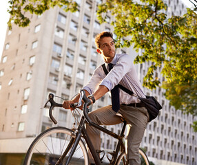 Cycling, bicycle and business man in city for commute, carbon neutral and transportation....