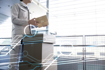 DX image of logistics and transportation Fresh workers carrying cardboard boxes in a warehouse or distribution center no-face