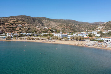 Obraz premium Andros island Batsi village Cyclades Greece. Aerial drone view of sandy beach, sea water blue sky.