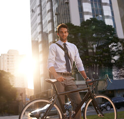 Cycling, portrait and business man in city for commute, carbon neutral and transportation. Sustainable, professional and travel with male employee walking with bike in urban town for journey and trip