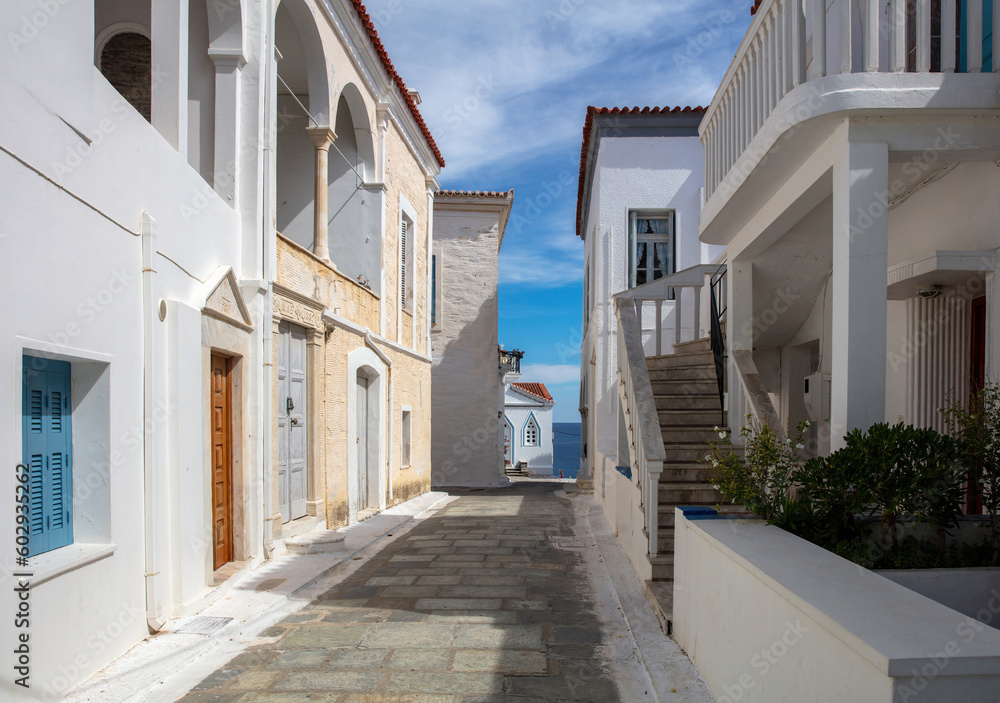 Wall mural greece, destination andros island chora town. cycladic architecture, sea sun blue sky summer day.