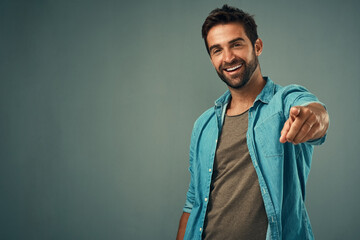 Pointing, mockup or portrait of happy man in studio for choosing accountability, motivation or...