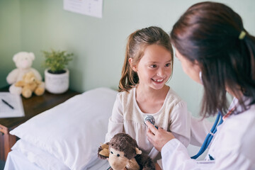 Healthcare, kids and a girl at a woman pediatrician for an appointment or checkup in the hospital....