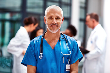 Healthcare, portrait of senior doctor or nurse with smile in hospital, happiness and support in...