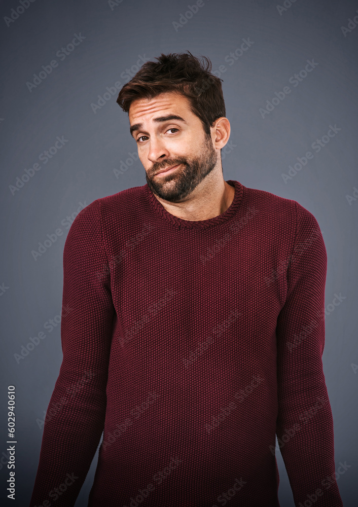 Poster confused, shrug and portrait of man in studio unsure against a grey background space. doubt, face an