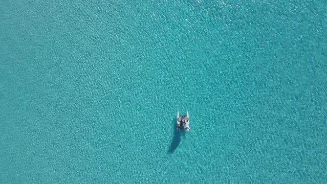 Beautiful cinematic aerial view of the Bahamas island - turquoise oceans, water sports sailing, beach walks, water bikes 