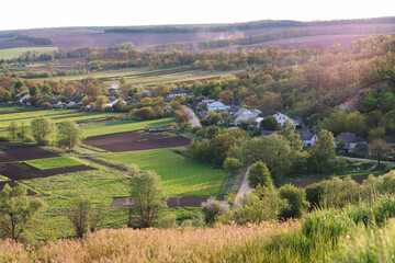 countryside in ukraine.Beautiful panorama.Summer landscape.Small village.View of the village and fields from above.Beautiful village.atmospheric place in Ukraine.Village gardens.Green gardens.country