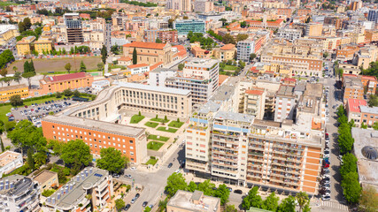 Aerial view of Palazzo Emme in Latina, Lazio, Italy. The building has the shape of an M like...