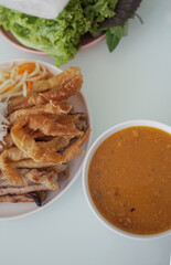 Vietnamese traditional grilled spring rolls served with shrimp dipping sauce    