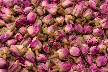 Dry tea roses isolated on white background.