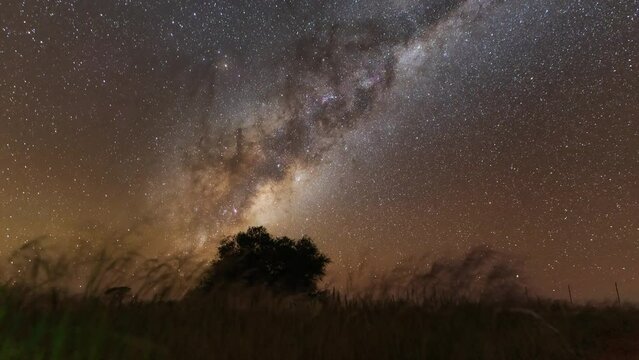 Captivating footage of the Milky Way galaxy shot in Namibia's starry night sky with perfect visibility. Witness the stunning beauty of our galaxy in motion.